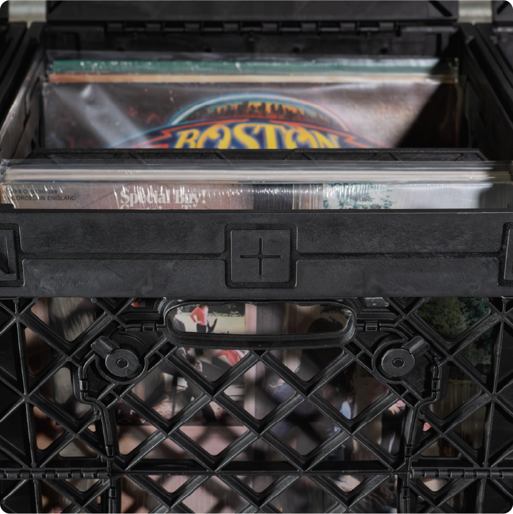 Black UbeCube CrateVinyl setup with records stored upright and divided into sections inside the crate.