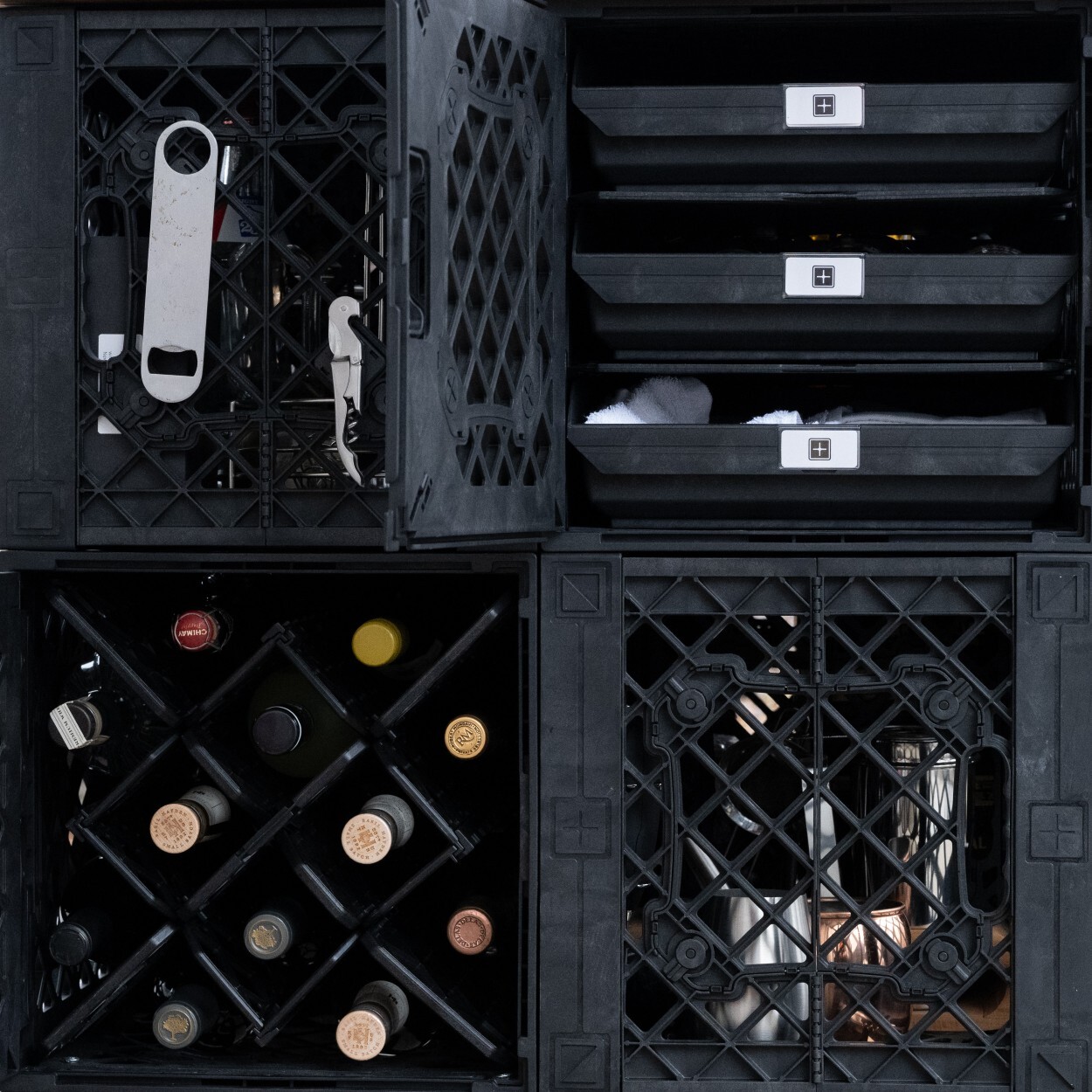 4 UbeCube Crates stacked and organized with wine and beverage gear using grab bins, crateshelves, and crate accessories to hang wine and beer openers.