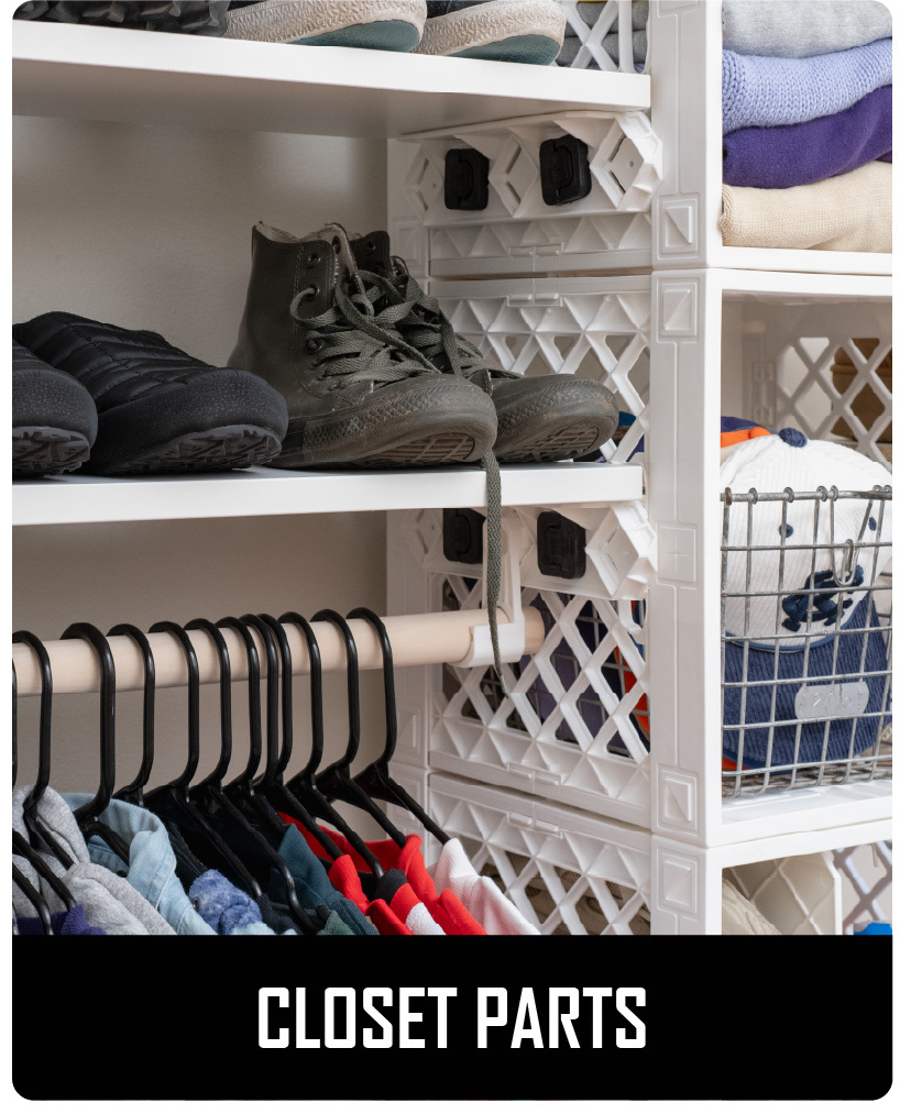 White CratePlay™ closet setup with shoes, folded clothes, hanging garments, and modular storage cubes.