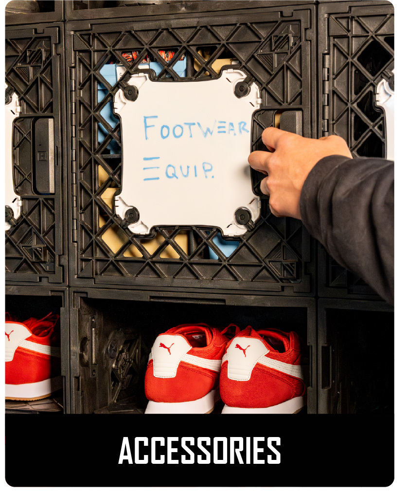 CratePlay™ accessory panel on a black crate with a whiteboard label for footwear and equipment storage.