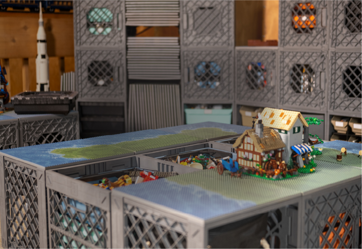 CratePlay™ build plate table with modular crates, building bricks, and a small brick village setup.
