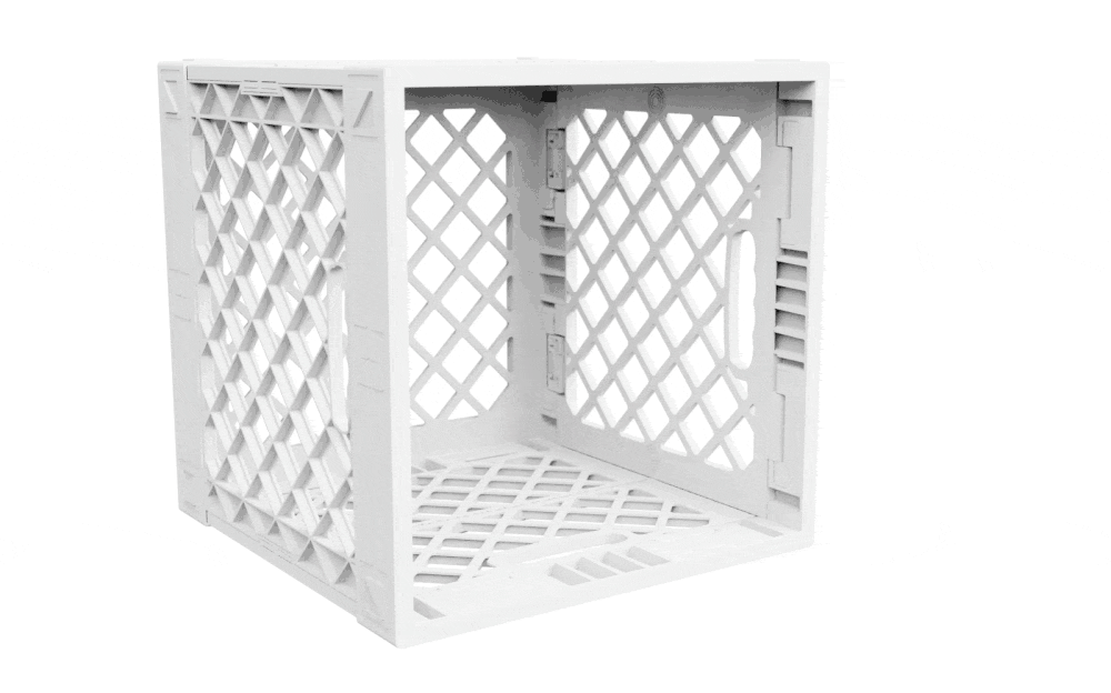Animated GIF showing a CrateDivider™ kit being installed into a white UC02 lidless UbeCube crate.