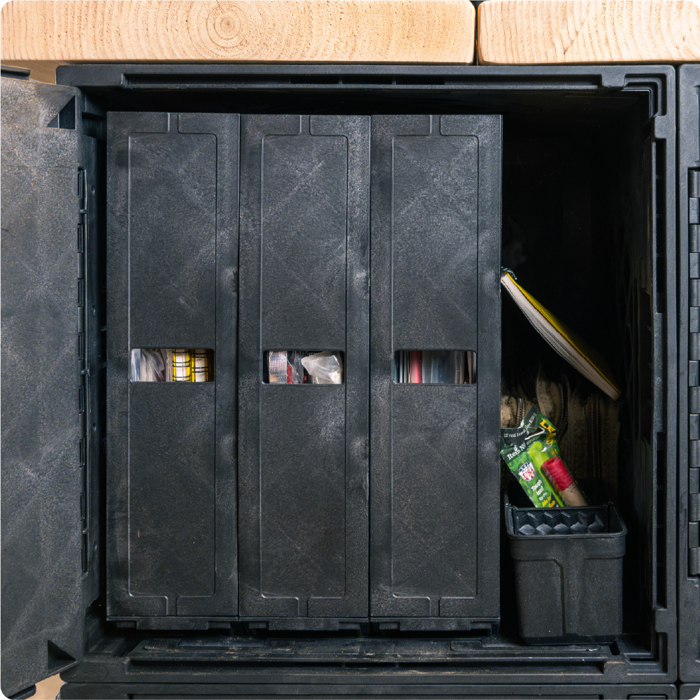 Black UbeCube crate used as file storage with upright document organizers, a side pocket, and an open crate door.