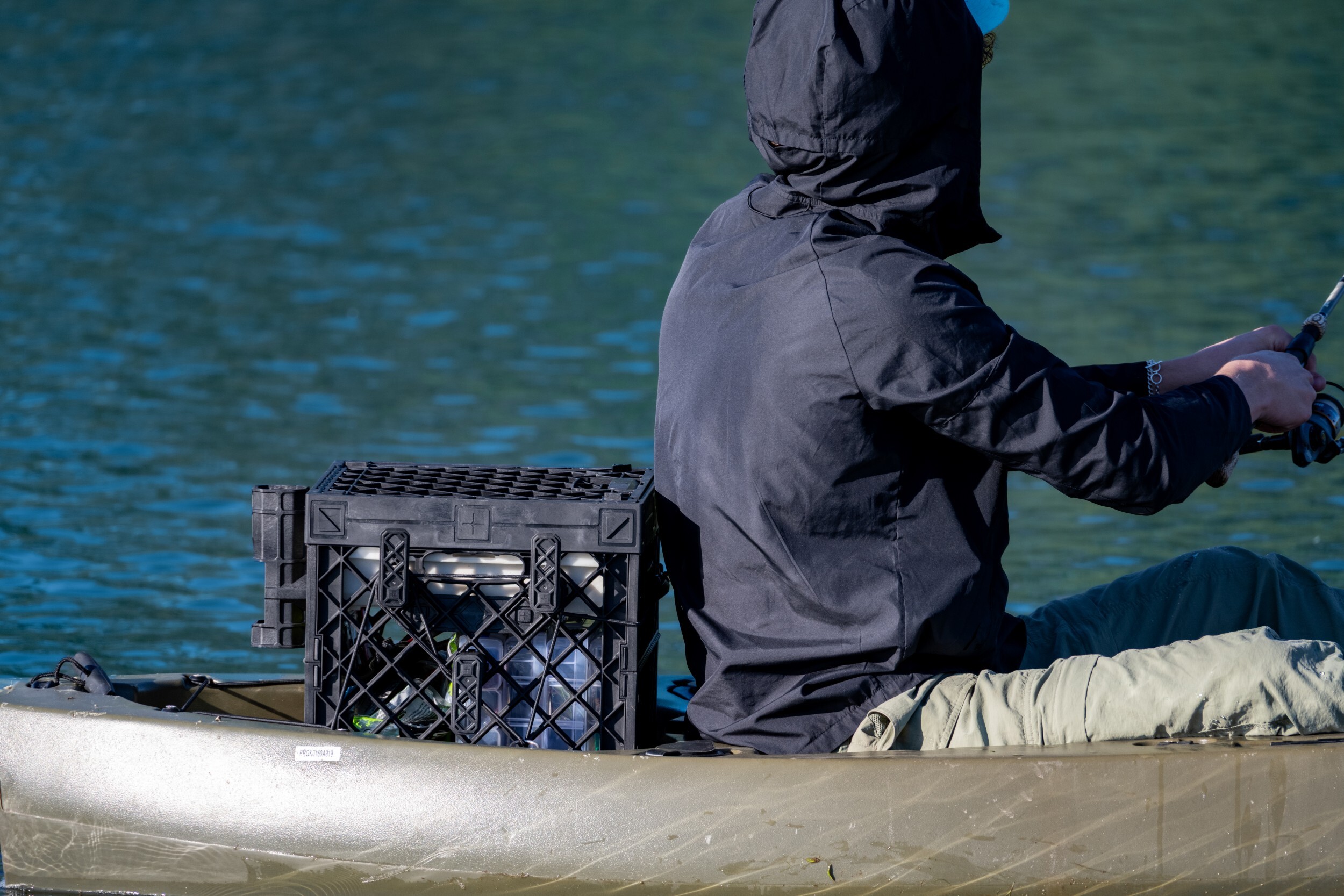 CrateWhite™ PaddleOn secured behind a kayak seat using crate-mounted tie-down points