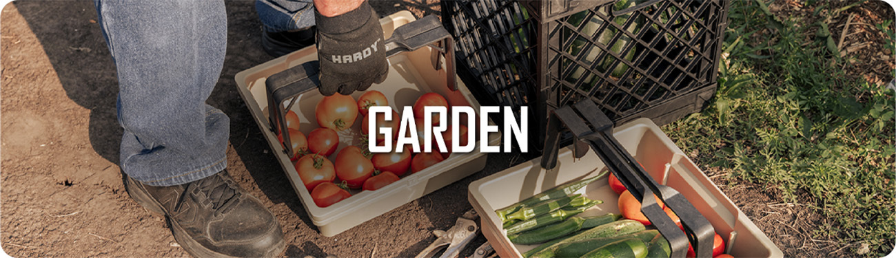 UbeCube garden storage setup with crates and trays holding freshly harvested tomatoes and zucchini. Text on image reads “GARDEN.”