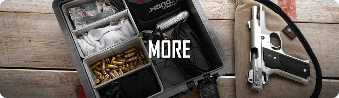 UbeCube storage tray organizing shooting range or tactical gear including ammunition, flashlight, and equipment, labeled ‘MORE’.