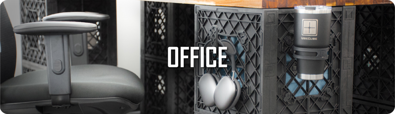 UbeCube modular desk setup in an office space with a chair, mounted cup holder, and hanging headphones on the crate side panel, labeled ‘OFFICE’.