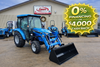 LS MT226 Cab 26 HP compact diesel tractor with enclosed cab and front loader attached.