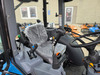 Enclosed heated and air-conditioned cab on LS MT357HC compact tractor for year-round comfort.
