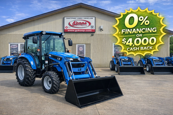 LS MT242 Premium Cab 42 HP compact diesel tractor with enclosed cab and front loader attached.