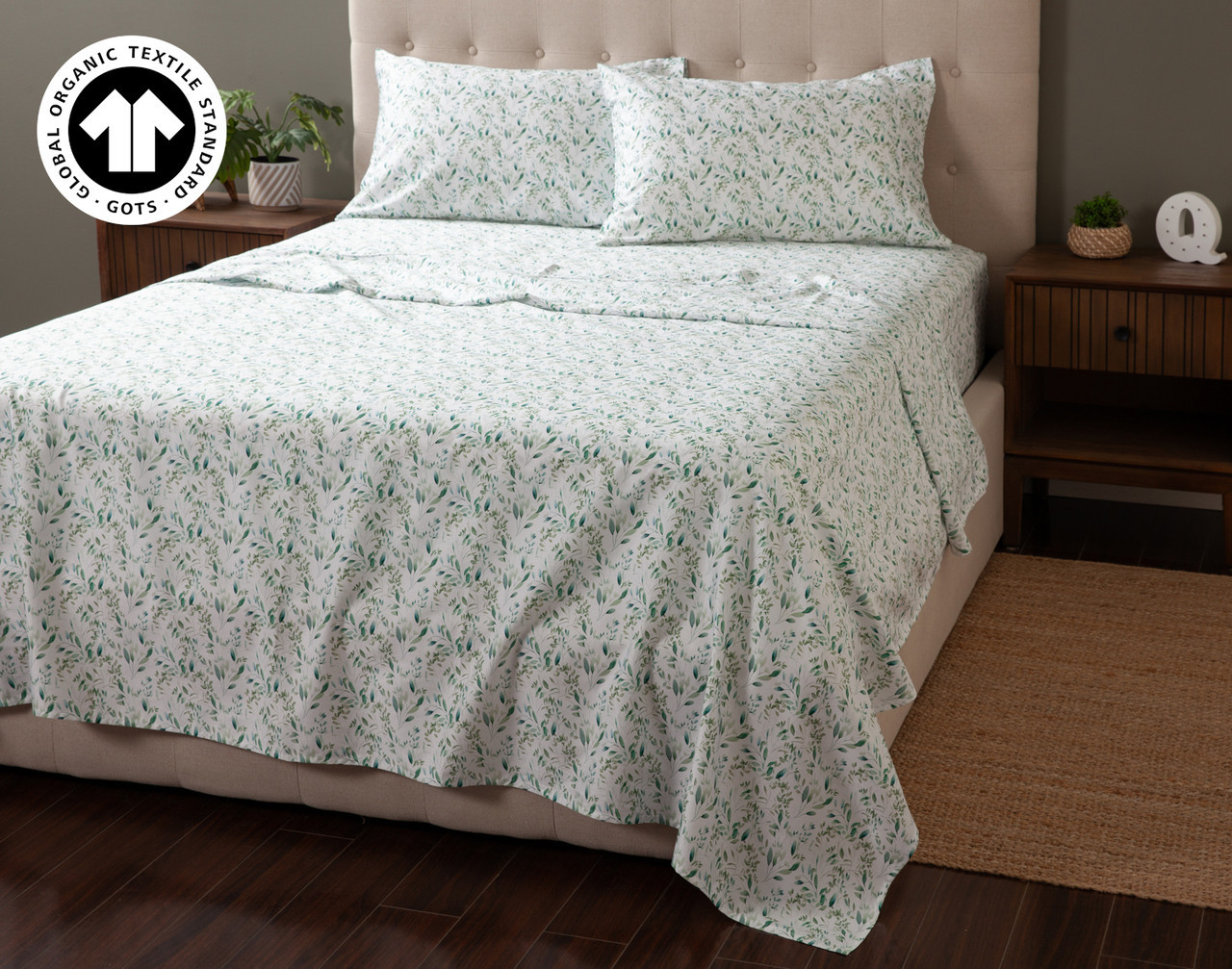 Angled view of our Folio Organic Cotton Sheet Set dressed over a queen bed.