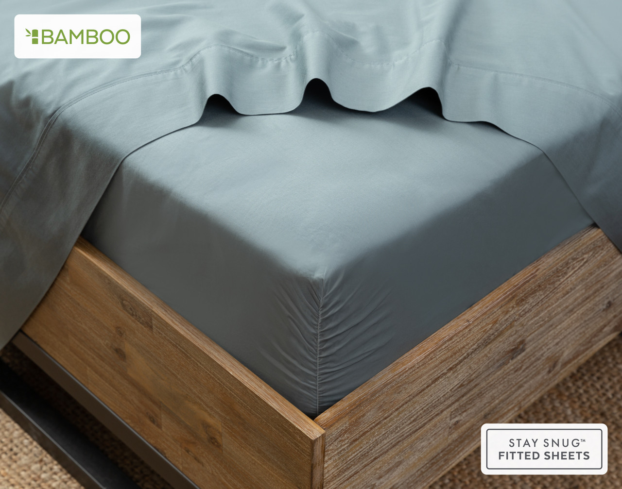 Angled view of our Bamboo Cotton Fitted Sheet in Spruce Green snugly wrapped around a mattress.