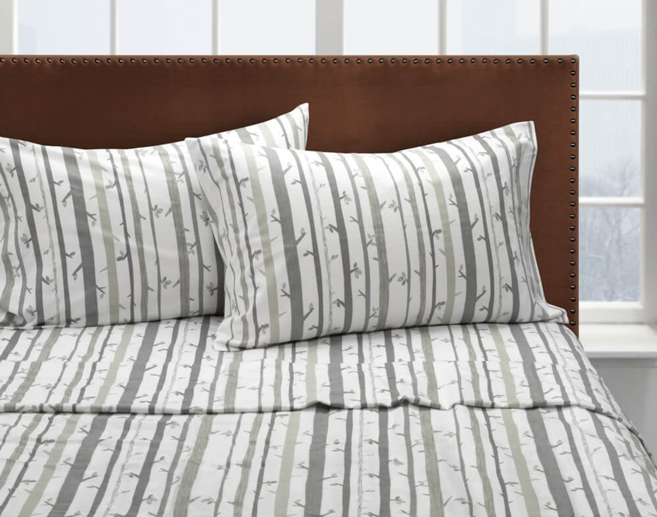 Front view of our Snowtrees Flannel Cotton Sheet Set dressed over a bed.