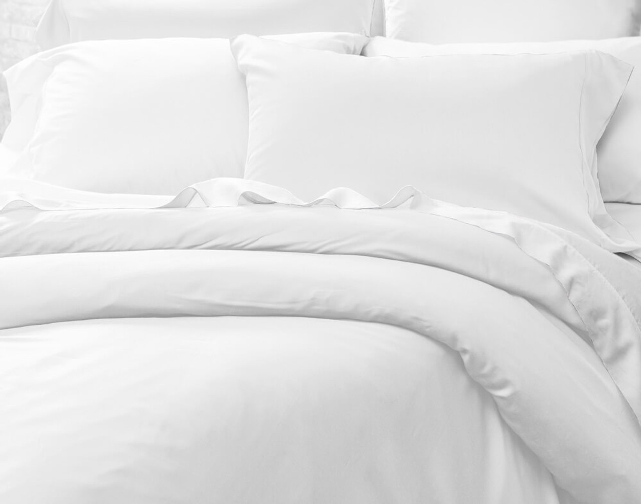 Full set of Cotton Blend Percale Sheets under a Cotton Blend Percale Duvet Cover.