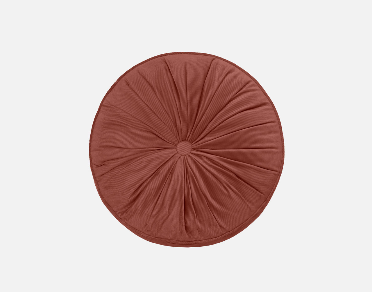 Our Round Corduroy Pillow in Clay sitting against a solid white background.
