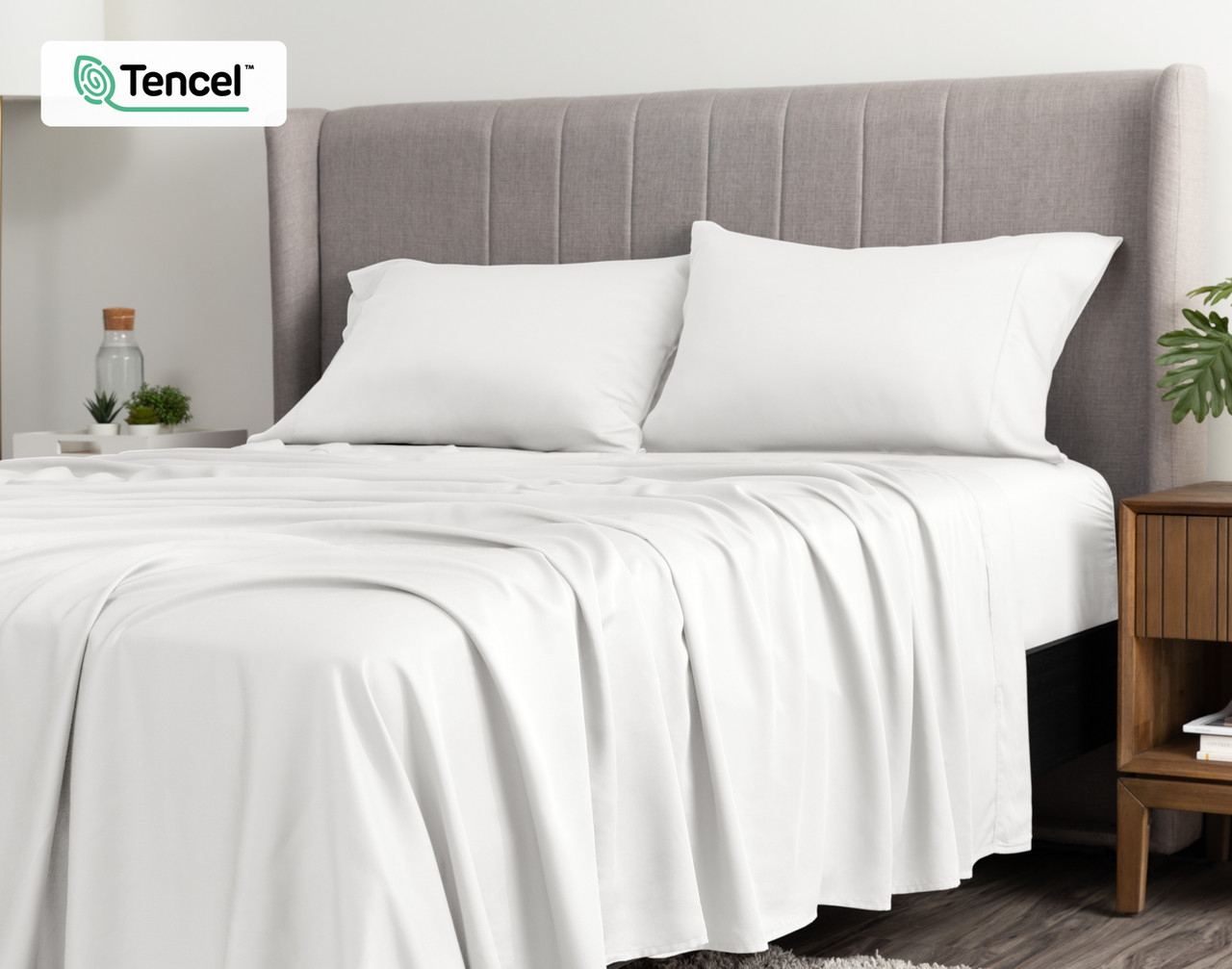 Angled view of a queen bed dressed in our BeechBliss TENCEL™ Modal Sheet Set in White.
