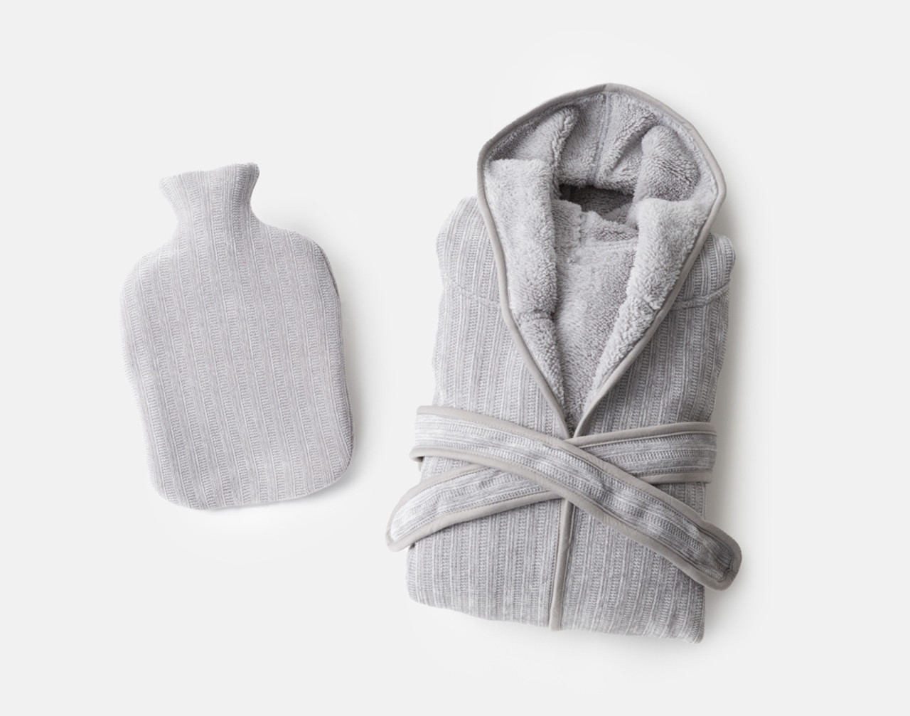 Top view of our Warm Me Up Gift Set in Grey with its folded White Chenille Sherpa Bathrobe and matching White Chenille Sherpa Hot Water Bottle.