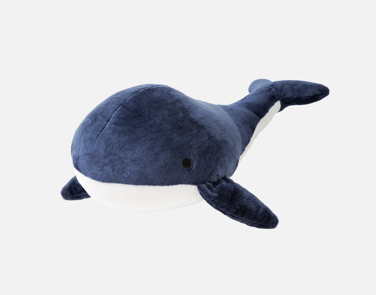 Front view of our Whale Cushion sitting on a solid white background.