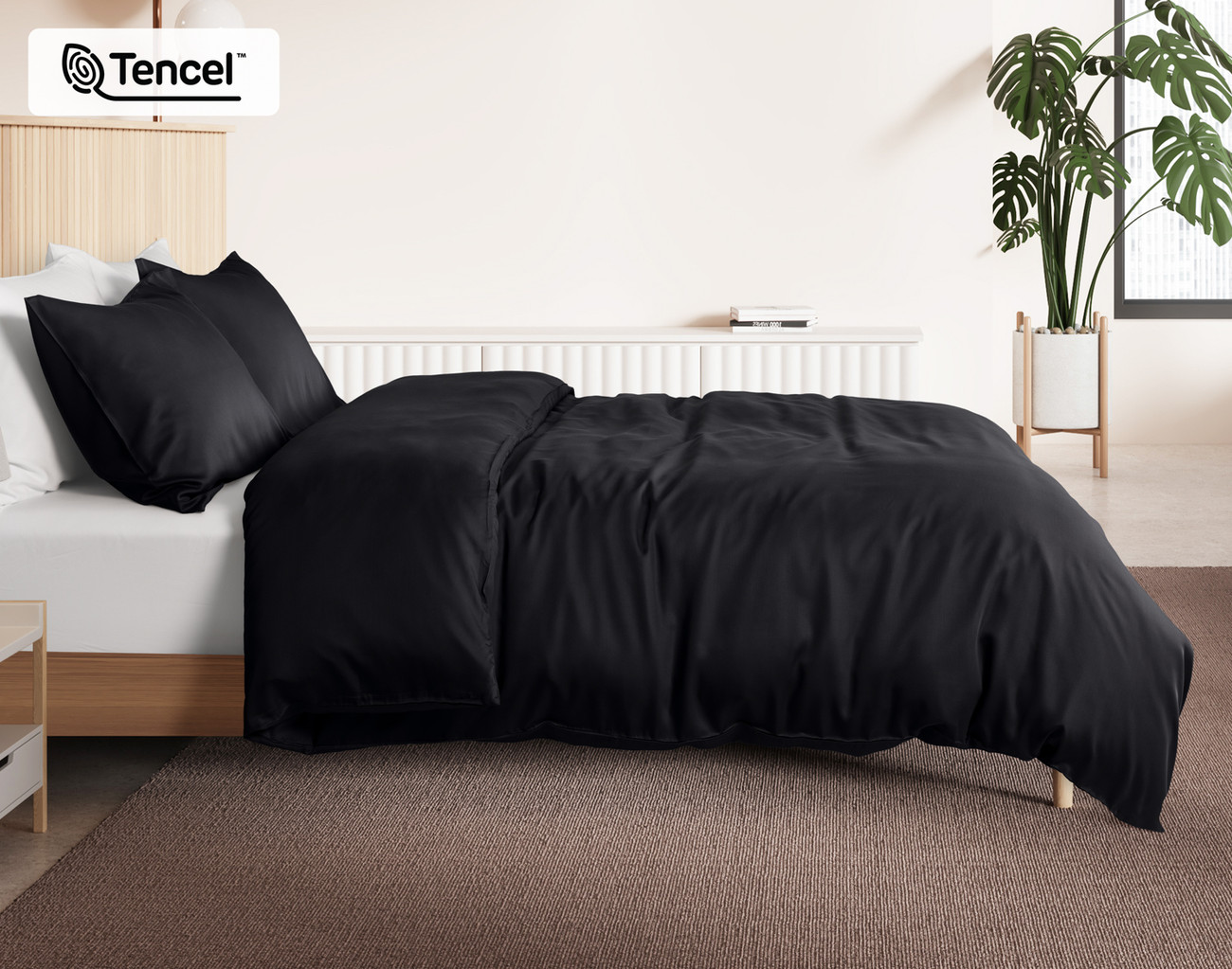Side view of our Black BeechBliss Duvet Cover dressed over a plain queen bed.