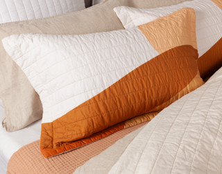Angled view of a coordinating pillow sham for our Golden Hills Cotton Quilt Set.