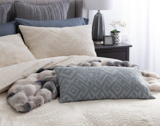 Our Marcona Pillow Shams dressing the head of a bed with matching sheets and accessories.