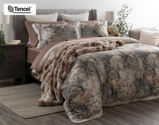 Angled view of our Captiva Duvet Cover dressing a queen bed with matching accessories.