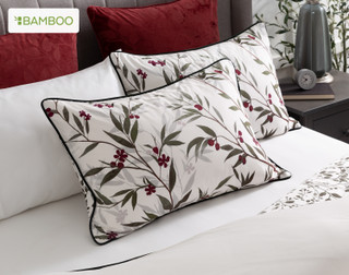 The head of a bed dressed in our Laurentian Pillow Shams and coordinating Euro Shams.