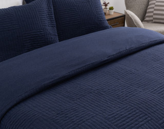 Close view of our Kye Duvet Cover Set dressing the head of a bed.