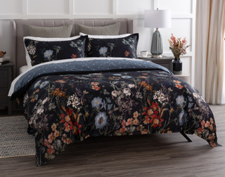 Angled view of our Sarita Duvet Cover dressing a queen bed in a modern room.