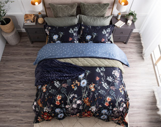 Top-down view of our Sarita Duvet Cover dressed with our Bonsai Sheets and matching green quilt set.