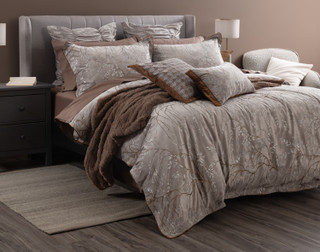 Angled view of our Luxembourg Velvet Duvet Cover dressing a queen bed with matching accessories.