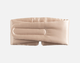 The reverse side of our 100% Mulberry Silk Blackout Sleep Mask in Champagne on a white background, showing the velcro fastening.