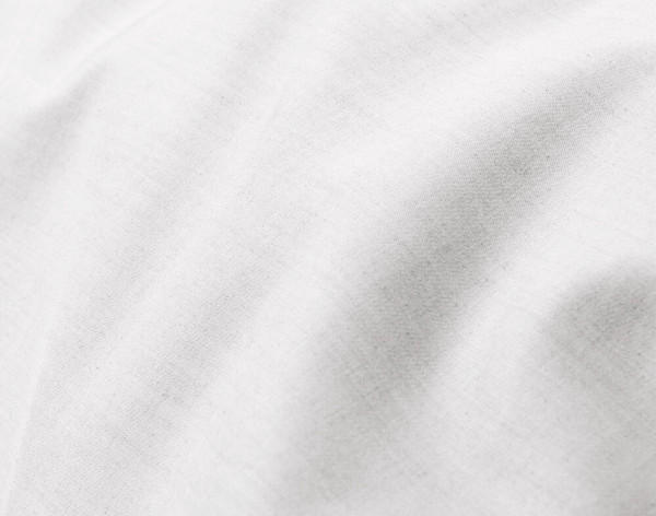 Close-up on the soft fabric over the surface of our Bamboo Cotton Duvet Cover in White.