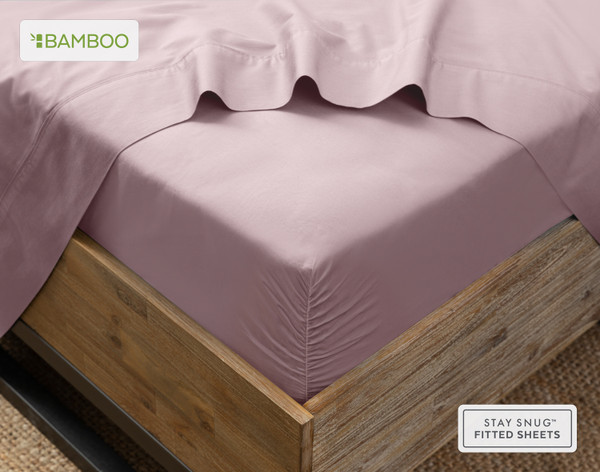 Angled view of our Bamboo Cotton Fitted Sheet in Orchid Purple snugly wrapped around a mattress.