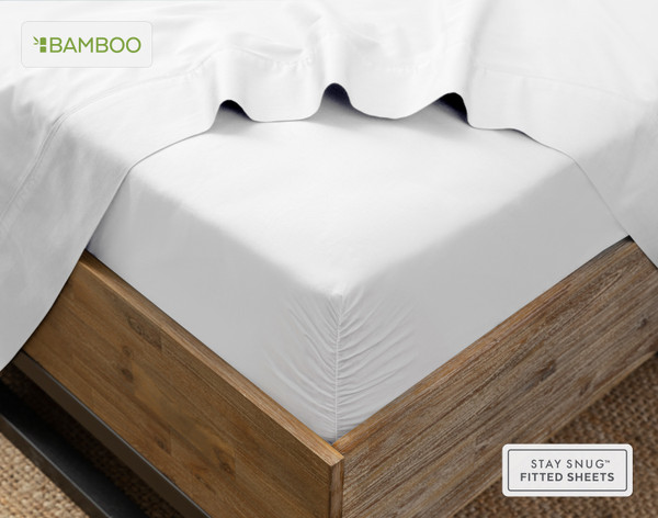 Angled view of our Bamboo Cotton Fitted Sheet in White snugly wrapped around a mattress.