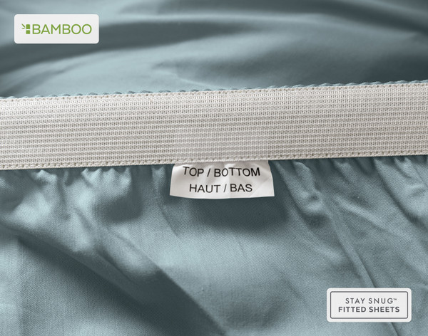 Close-up on a tag on our Bamboo Cotton Fitted Sheet in Spruce saying "Top" and "Bottom".