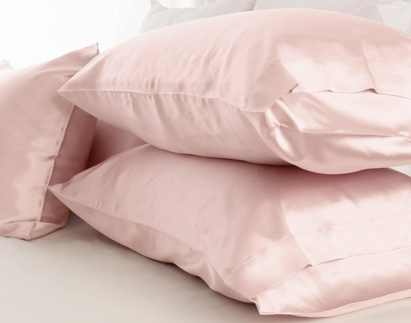 Three pillows stacked together in our Mulberry Silk Pillowcases in Blush.