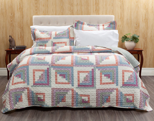The Cassie Coverlet Set features cubes in shades of orange, pink, purple, blue, and green creating diamond shapes on an off-white background.