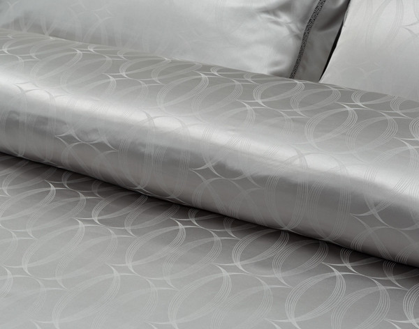 View of Armoire Silk blend duvet cover set circular jacquard pattern