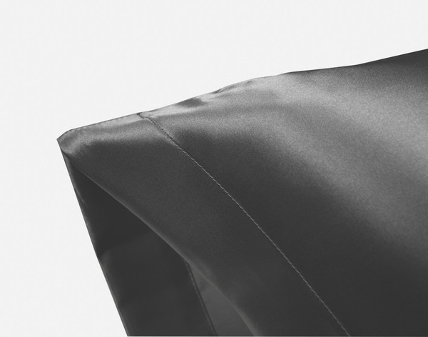 Corner of an Charcoal Satin Pillowcase showing envelope fold