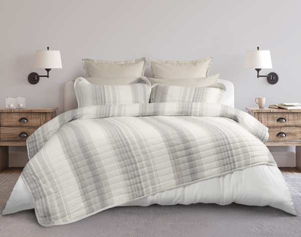 Our Sand Dune Cotton Quilt Set over a queen-sized bed in a white bedroom.