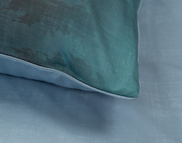 Close up of our Nairn Pillow Sham with teal blue gradient and sky blue colour block reverse.