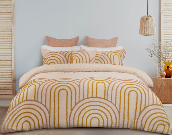 Our Maeve Bedding Collection features a stylish circular orange tufting on a tan cream chenille surface.