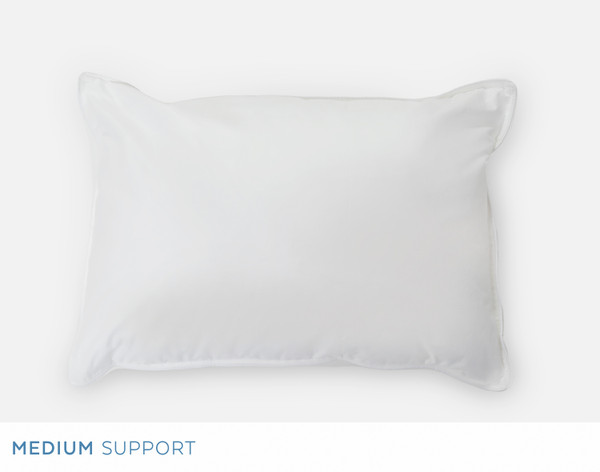 Front view of our Petite Microfiber Pillow resting over a solid white background.