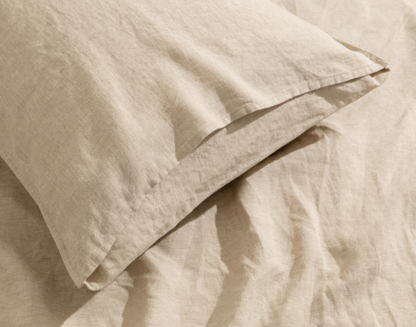 Close-up on the envelope enclosure on one of our Signature European Linen Pillowcases in Natural.