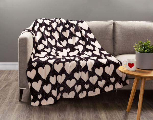 Our Valentine's Fleece Throw in Big Heart draped over a couch.