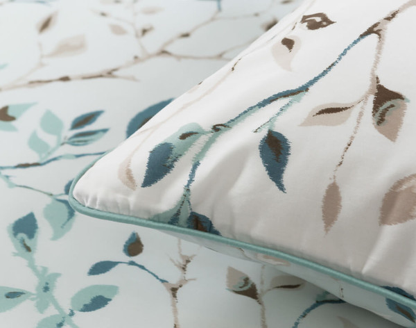 Close-up on the watercolour design and aqua piping on our Lakewood Pillow Sham.