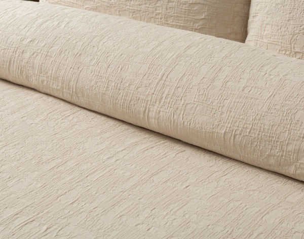 Close-up of rolled top edge of our Stonehaven Beige Duvet Cover to show its soft surface.