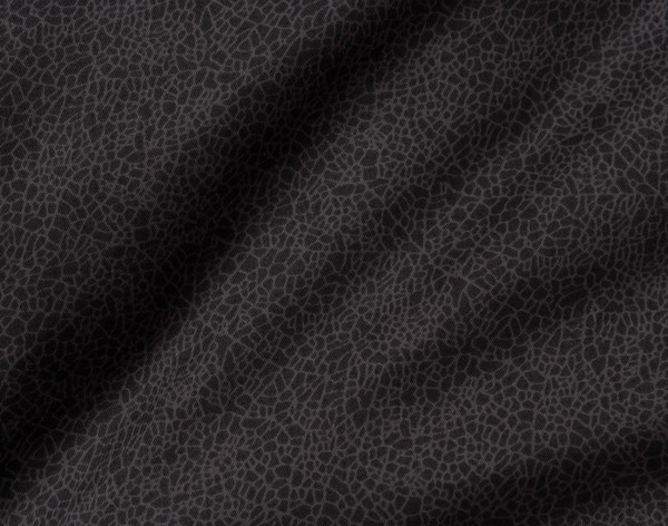 Close-up on the midnight black solid reverse on our Nightfall Duvet Cover.