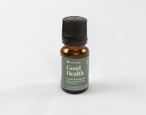 Our Good Health Laundry Blend Essential Oil in its small bottle sitting against a solid white background.